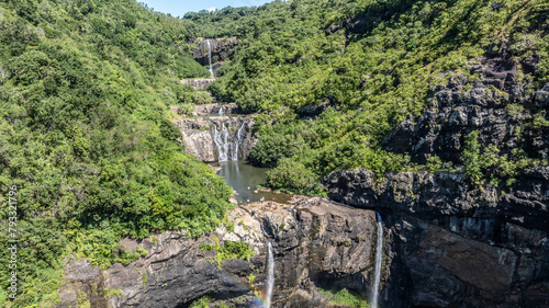 Fototapeta Naklejka Na Ścianę i Meble -  Aerial landscape view of Tamarind Falls, known as Seven Cascades in the tropical island jungle of Mauritius surrounded by lush green forested mountains