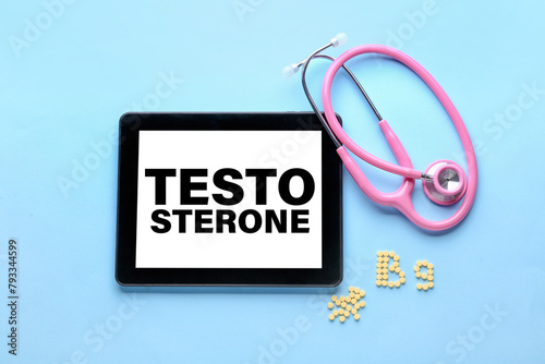 Stethoscope and text B9 made of folic acid pills on color background photo