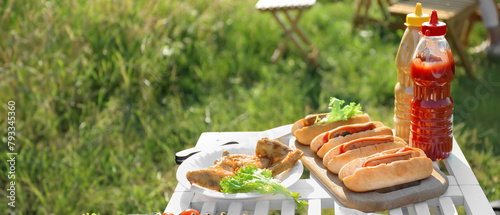 Tasty hot dogs and plate wi...