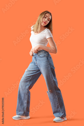 Young woman in stylish jean...