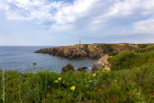 Small lighthouse on the beautifull portuguese village of Porto Covo, located on the vicentine coast, one of the mos touristic routes of Portugal photo