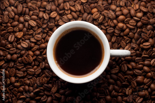 Cup coffee on coffee beans