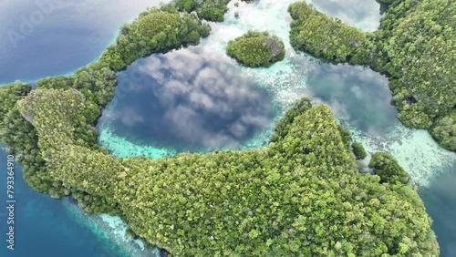 Early morning light illuminates the beautiful limestone islands of Pef in Raja Ampat, Indonesia. This remote, tropical region is known to harbor the world's greatest marine biodiversity.