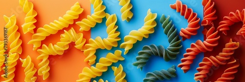 High-contrast image of pasta in a playful arrangement of orange, blue, and red for culinary projects or food-themed graphics.