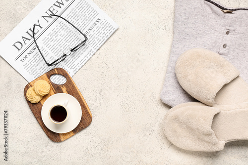 White slippers, newspaper a...