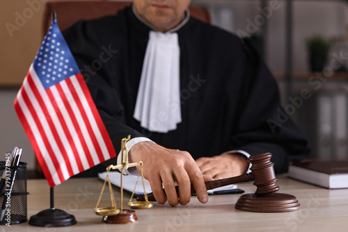 Mature judge with gavel on ...