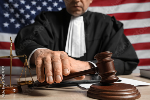 Mature judge with gavel on ...