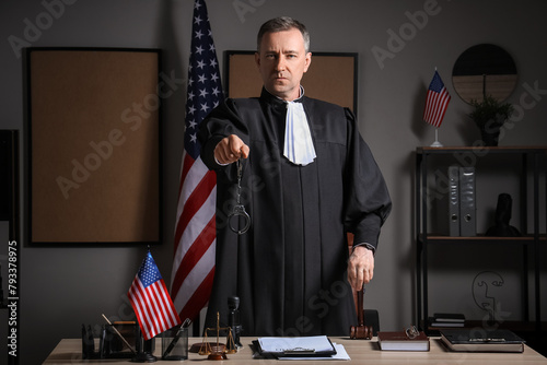 Mature judge with handcuffs...
