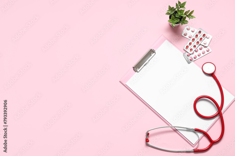 Blank clipboard with stethoscope and pills on pink background. World Health Day Blank clipboard with stethoscope and pills on pink background. World Health Day