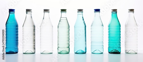 An array of colorful bottles containing various liquids lined up on a table