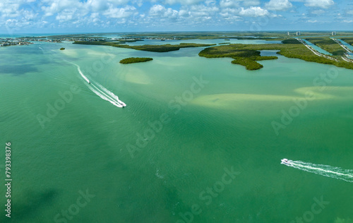Boats zip across the ocean water in the Gulf of Mexico in Southwest Florida