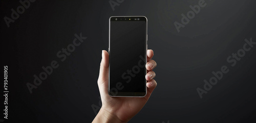 front view of hand holding a smartphone screen on black background  photo