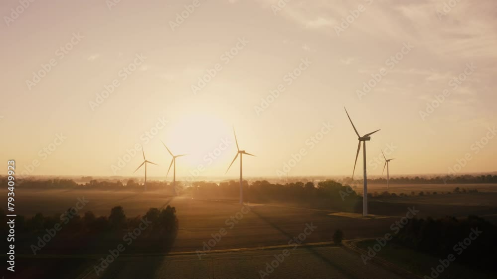 As the sun peeks over the horizon, casting golden hues across the sky ...