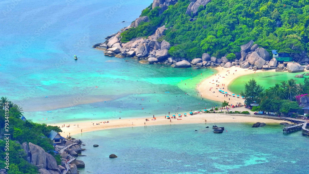 Escape to a serene paradise boasting pristine white sands, turquoise waters, and verdant landscapes for an unforgettable retreat. Bird's eye view. Sea background. Nangyuan island, Thailand.

