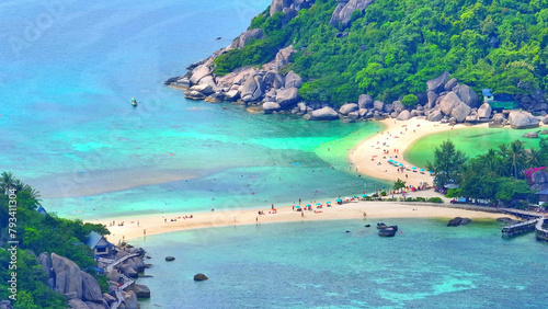 Escape to a serene paradise boasting pristine white sands, turquoise waters, and verdant landscapes for an unforgettable retreat. Bird's eye view. Sea background. Nangyuan island, Thailand.  © Punyawee
