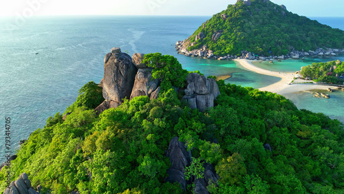 Koh Nangyuan is a picturesque trio of islands connected by sandbars, offering unparalleled beauty and serenity. Flight over the sea. Koh Nangyuan, Surat Thani Province, Southern Thailand.  © Punyawee
