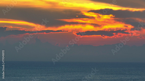 Drone s eye view reveals the boundless sea merging with the sunset horizon  an awe-inspiring spectacle of colors and tranquility. Top view Aerial view of drone. Sea background.  