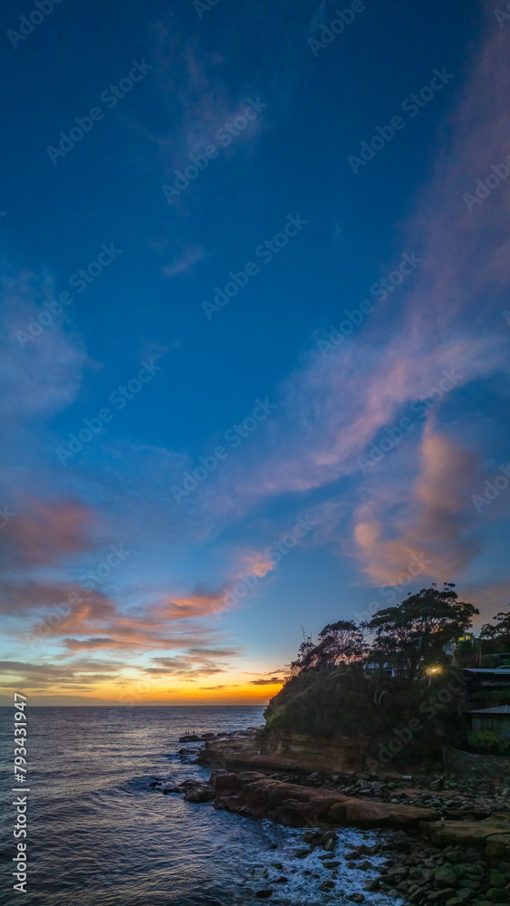Fototapeta premium Dawn by the sea with clouds