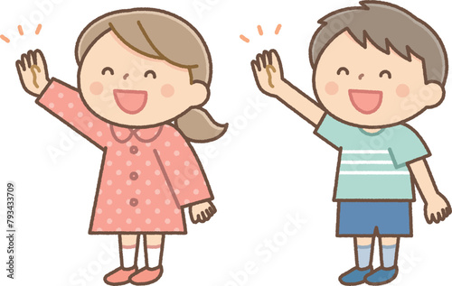 笑顔で手をあげる男の子と女の子