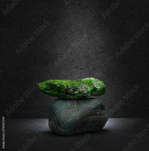 green diopside stone for the podium on a dark background