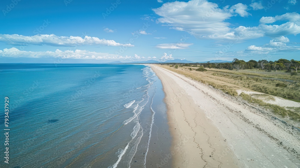 Beautiful sea view with waves, clear blue sky and beach sand