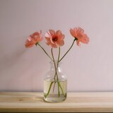 pink flowers in a glass vase, in the style of multi-coloured minimalism, life stock, stock photos	