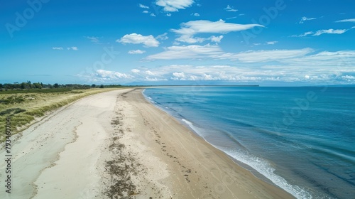 Beautiful sea view with waves, clear blue sky and beach sand