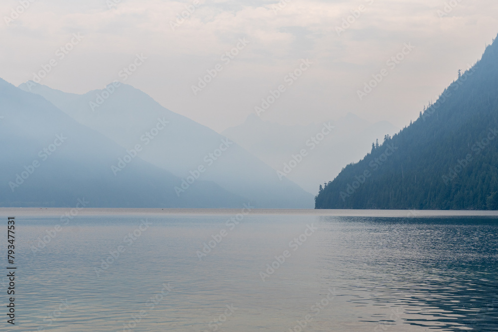 Beautiful waters of the Chilliwack Lake park foggy clouds and mountains