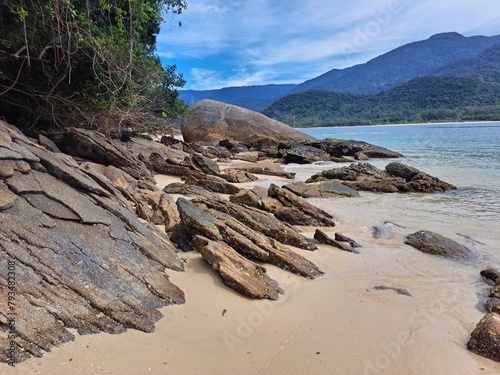 Wallpaper Mural Pelado Island in Paraty, mountains in the background,sky with clouds, large rocks, and calm sea. Natural swimming pool and warm water Torontodigital.ca
