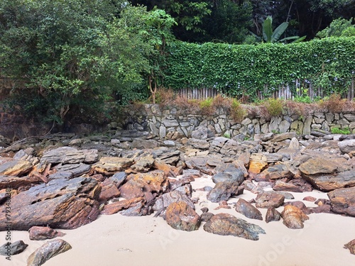 Wallpaper Mural Pelado Island in Paraty, mountains in the background,sky with clouds, large rocks, and calm sea. Natural swimming pool and warm water Torontodigital.ca