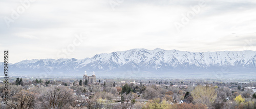 Tops of Logan City Utah White Capped Mountains