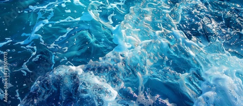 An intense wave breaking on the ocean surface, creating a stunning splash and foam in the blue water