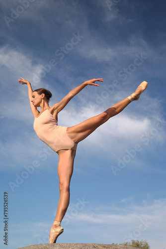 young woman ballerina in a nude bodysuit