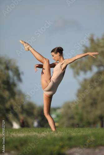 young woman ballerina in a nude bodysuit