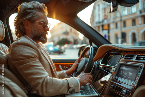 With the sunroof open and sunlight streaming in, the businessman transforms his luxury car into a mobile office, typing away on his laptop with the city skyline visible in the background  photo