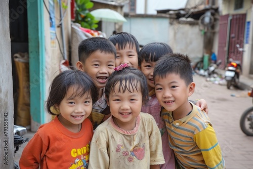 Group of asian kids smiling and looking at camera in the street