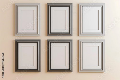 Six minimalist frames in varying shades of gray on a light beige wall, designed for a sophisticated and versatile gallery
