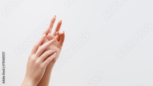 Trend milk manicure . milky look . Beautiful Woman Hands. Female Hands Applying Cream, Lotion. Spa and milk Manicure concept. hands with french manicure. Soft skin, skincare concept. Hand Skin Care. photo