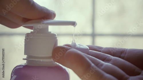 Washing hands with antibacterial liquid soap	 photo