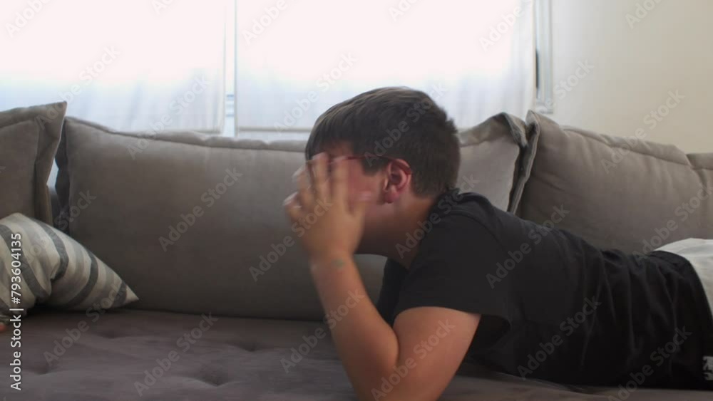 Caucasian boys playing armwrestling game at home, laying on the sofa, 4k Caucasian boys playing armwrestling game at home, laying on the sofa, 4k