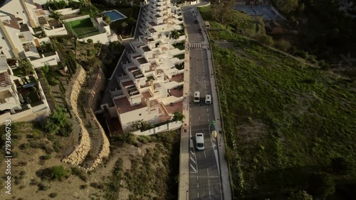 Unveiling an aerial vista of Malaga's residential expanse, unveiling a panoramic vista stretching to the sea horizon, evoking the essence of travel and exploration. photo