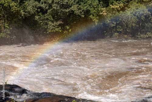 rainbow on a river in the afternoon photo