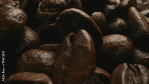 Super up close macro dolly from left to right video of roasted coffee beans.