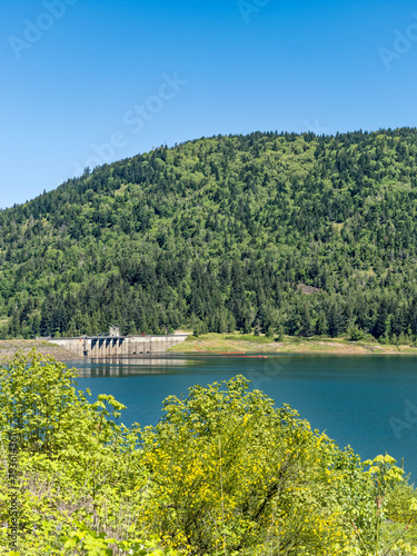 Forested mountains rise behind the Lookout Point Dam and reservoir near Lowell, Oregon, USA