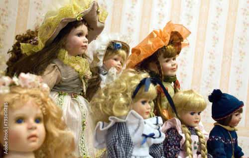 Doll collection in a bedroom