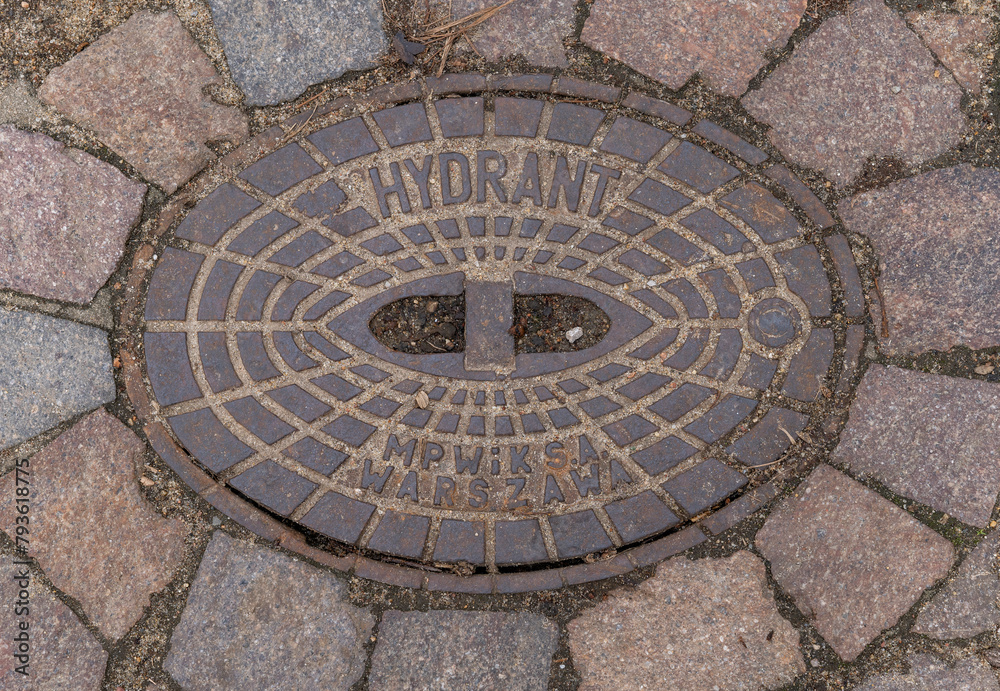 manhole cover on the pavement