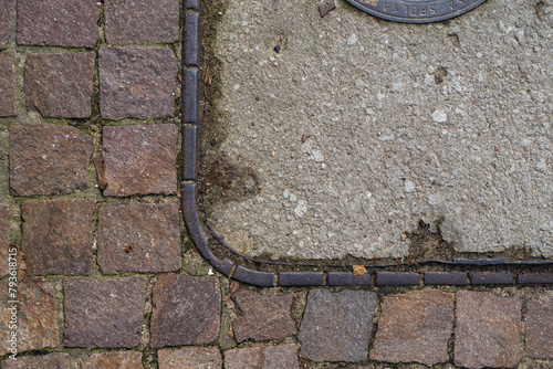coner of square manhole cover on a paving