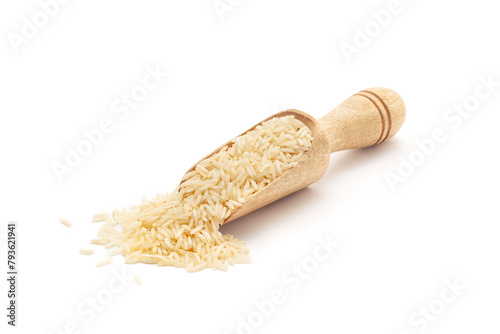 Front view of a wooden scoop filled with Organic White rice (Oryza sativa). Isolated on a white background.