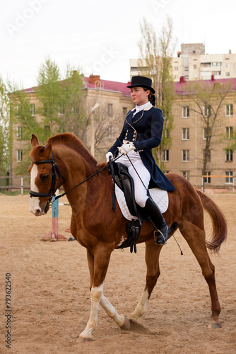 Poised equestrian in formal attire during outdoor training