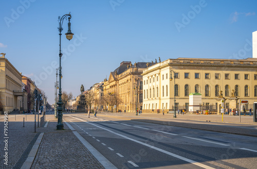 A view of the iconic Unter den Linden Street in Berlin, showcasing the equestrian statue of Frederick the Great under a clear sky. Berlin, Germany